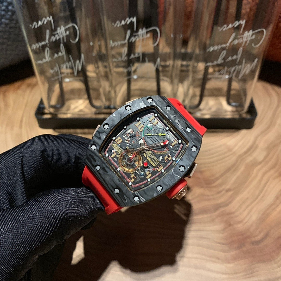 Richard Mille watch side angle, black skeleton dial and red strap on display glove