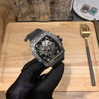 Octagonal skeleton watch with black strap and blue dial, side view with crown