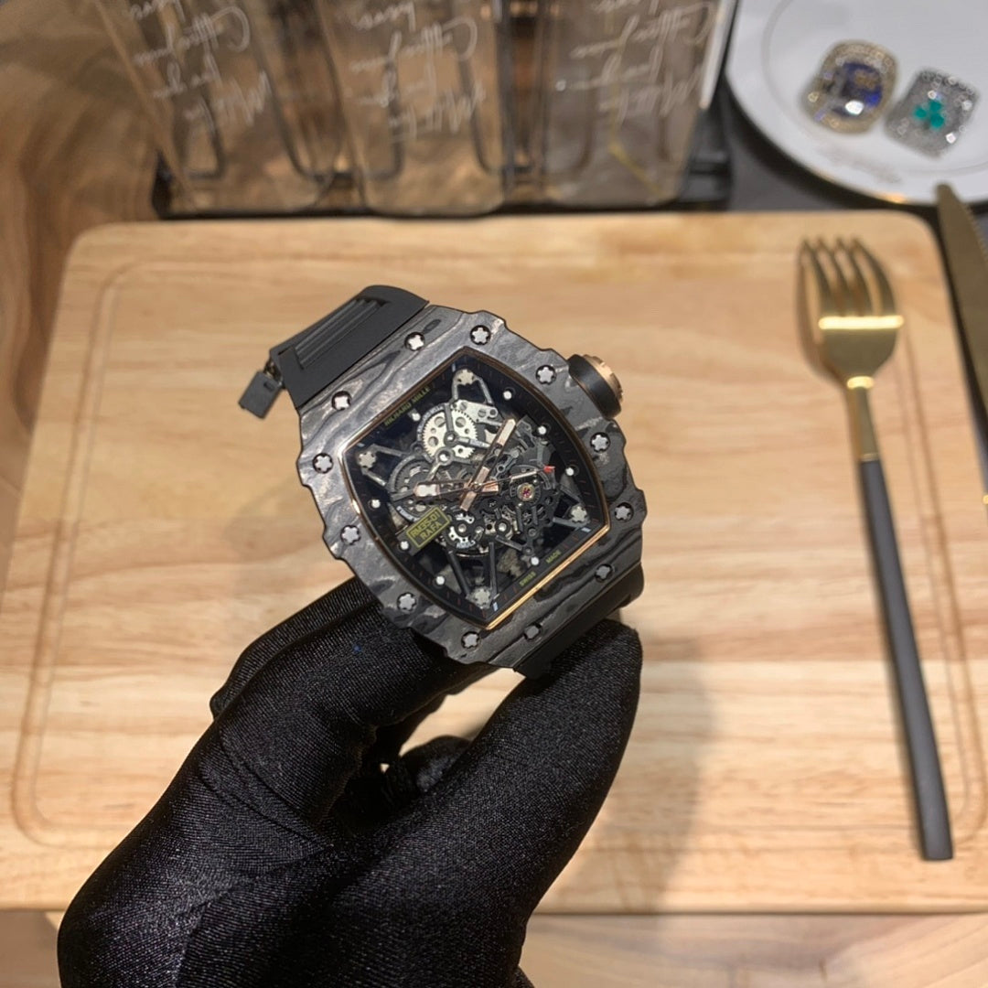 Octagonal skeleton watch with black strap and blue dial, side view with crown