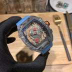 Richard Mille watch with blue fabric strap, dark case and red-accent skeleton dial