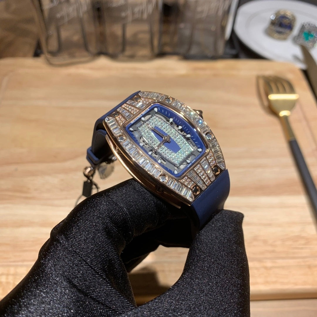 Richard Mille wristwatch, three-quarter view, blue dial and diamond-set case on blue strap