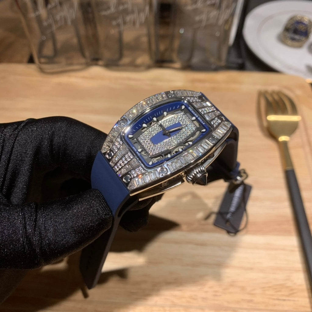 Richard Mille watch angled view, blue strap with silver jeweled bezel and crown details