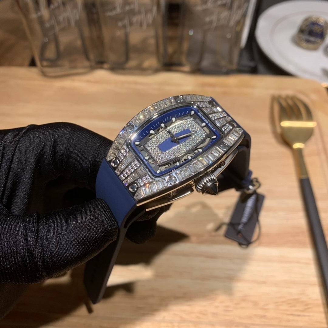 Richard Mille watch angled view, blue strap with silver jeweled bezel and crown details