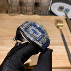 Richard Mille watch tilted, blue strap with silver jeweled case, on black glove