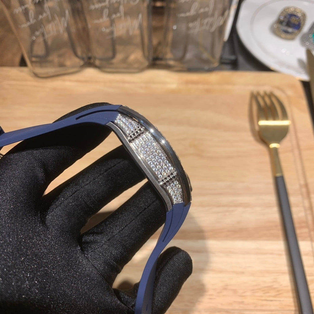 Richard Mille watch side view, blue strap and silver jeweled bezel edge