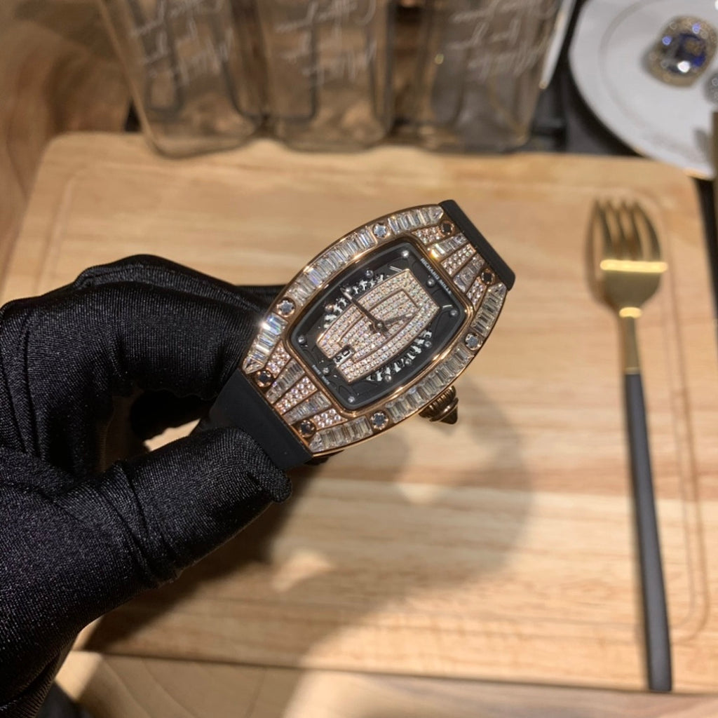 Black dial luxury watch with diamond-studded case and black strap, angled view