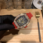 Red silicone wristwatch with detailed dial and jeweled bezel