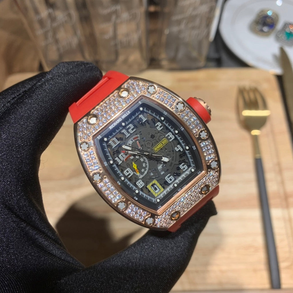 Red silicone wristwatch with dark blue dial and jeweled bezel