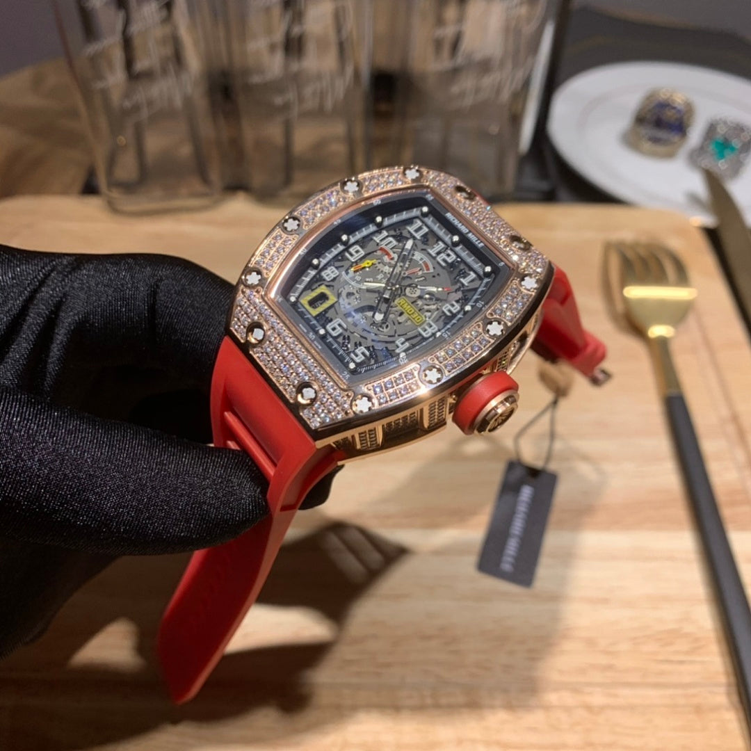 Red silicone wristwatch with dark dial and diamond-studded bezel