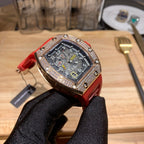 Red silicone wristwatch with black dial and jeweled bezel