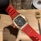 Red silicone wristwatch with metal case and jeweled bezel side view
