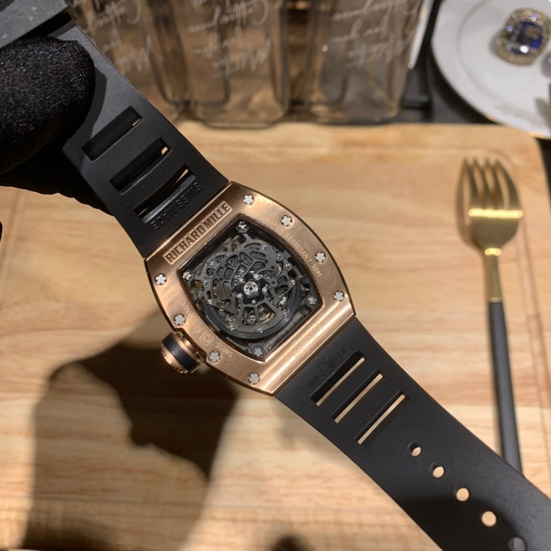Richard Mille watch detail: black rubber strap and jeweled bezel over a dark dial