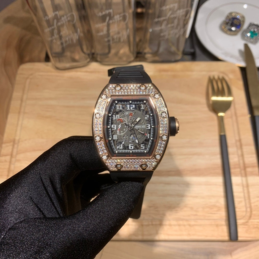 Richard Mille watch with jeweled bezel and dark dial, front view in black glove
