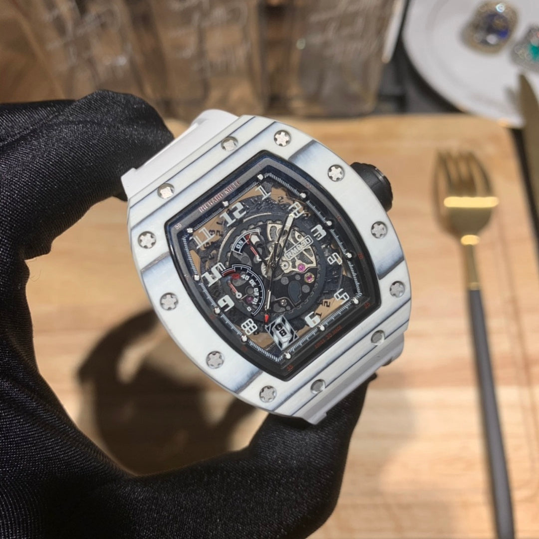 Richard Mille wristwatch face close-up, silver case with black skeleton dial.