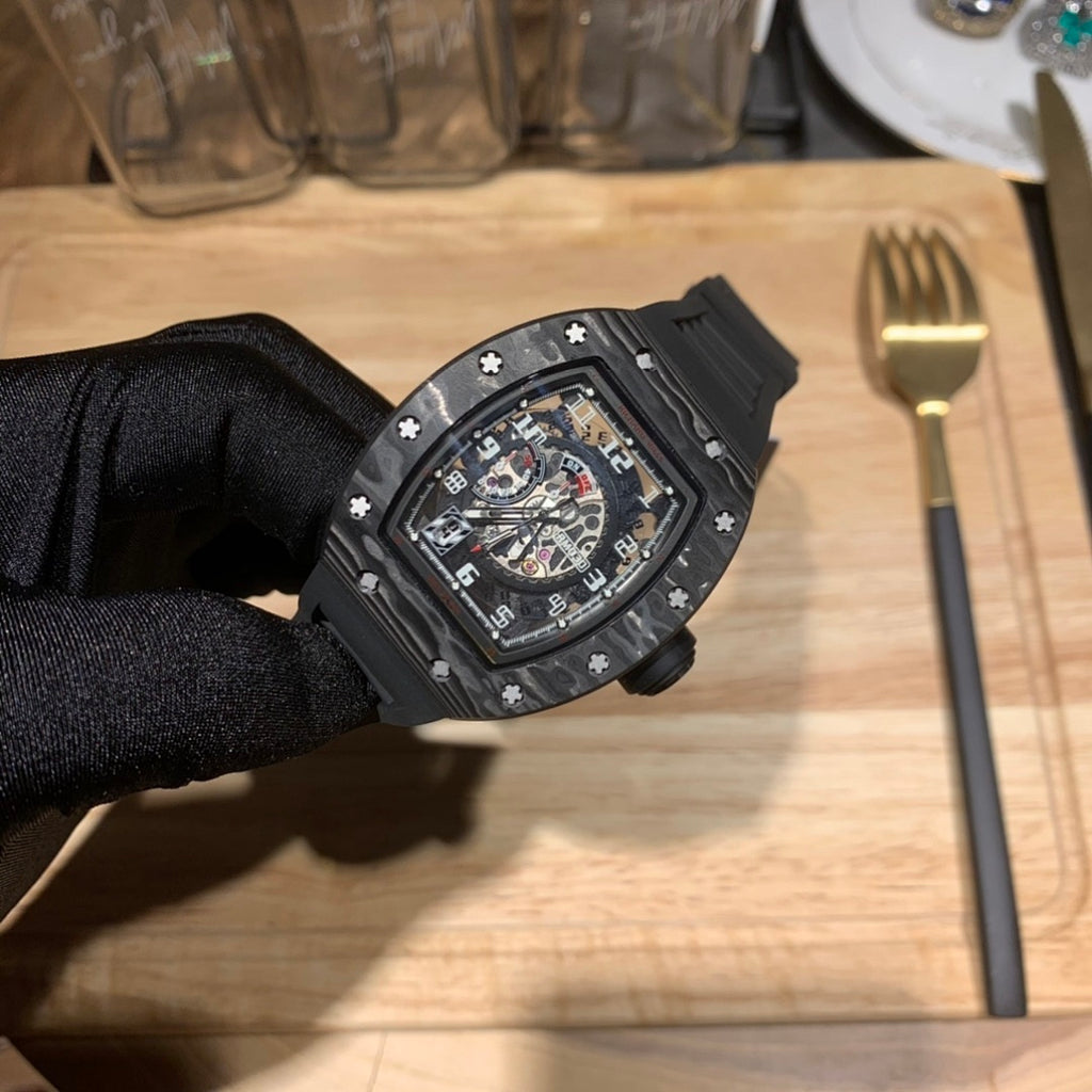 Richard Mille watch with black case and black strap, front view of skeleton dial