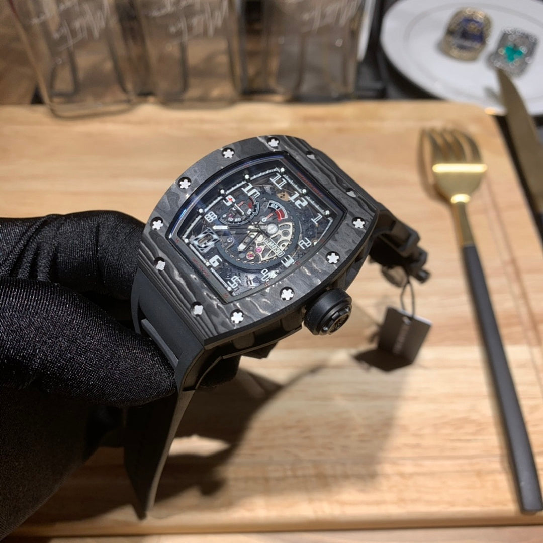 Richard Mille watch front view with black case, skeleton dial, and crown side knob