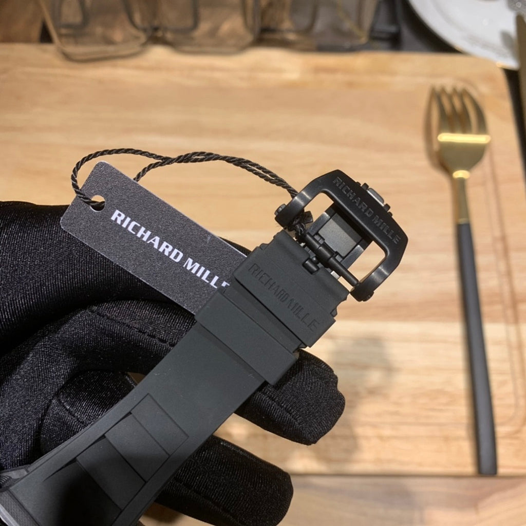 Richard Mille watch strap buckle with black clasp and branded tag
