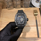 Richard Mille watch front view with black cushion case and skeleton dial on black strap