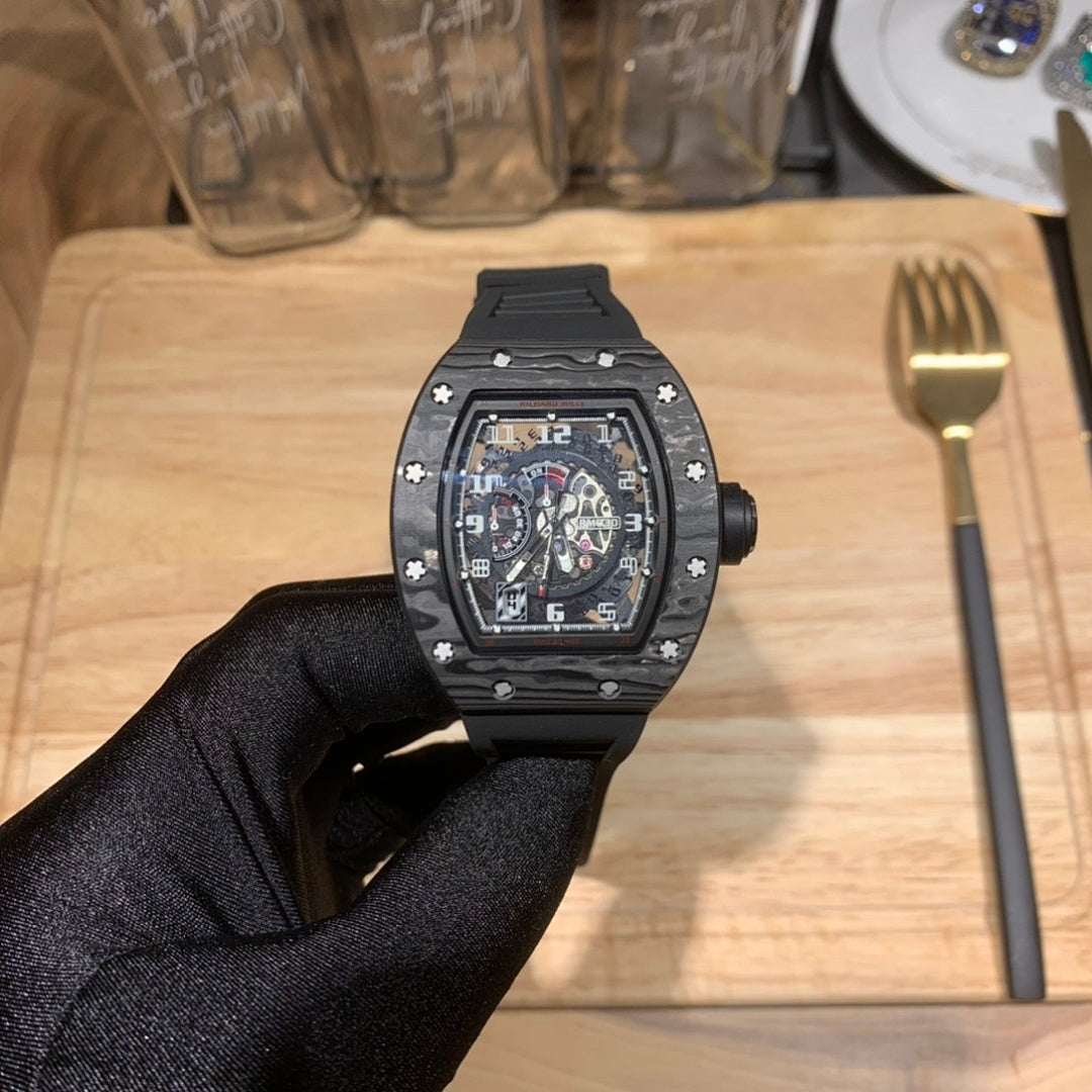 Richard Mille watch front view with black cushion case and skeleton dial on black strap