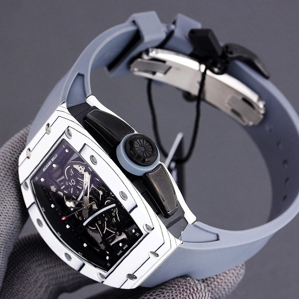 Richard Mille watch back view with light blue rubber strap and black hardware details.