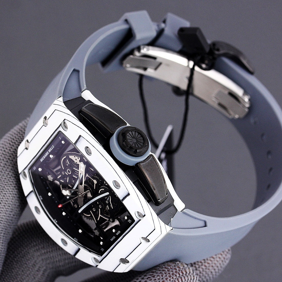 Richard Mille watch back view with light blue rubber strap and black hardware details.
