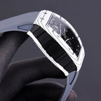 Richard Mille watch side view with white-toned case and black rubber strap.