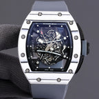 Richard Mille watch front view with white-toned bezel, blue skeleton dial, and light blue strap.
