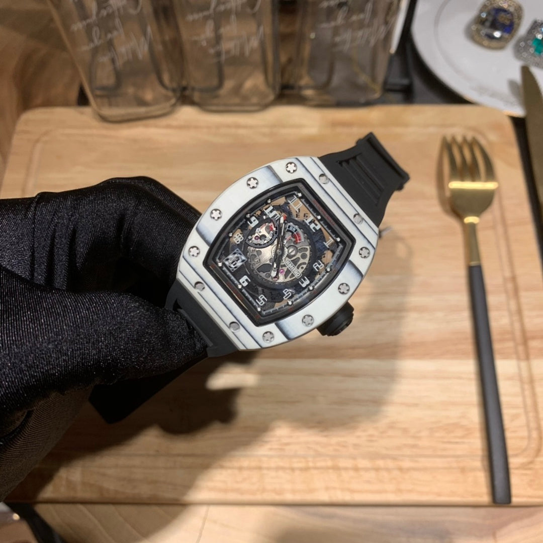 Richard Mille watch side view, black dial in silver case, black rubber strap