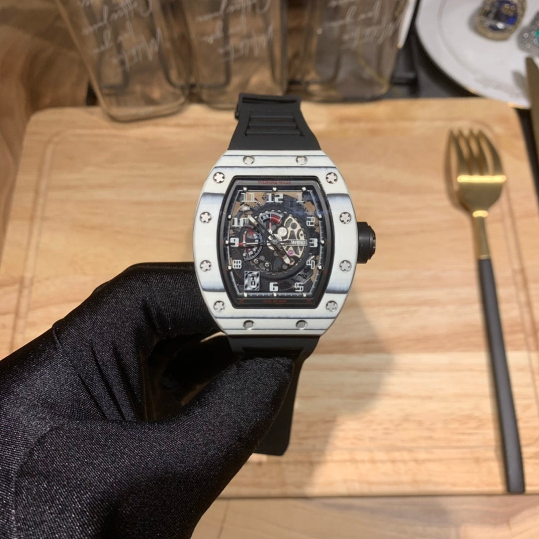 Richard Mille watch front view, black dial and silver case on black glove