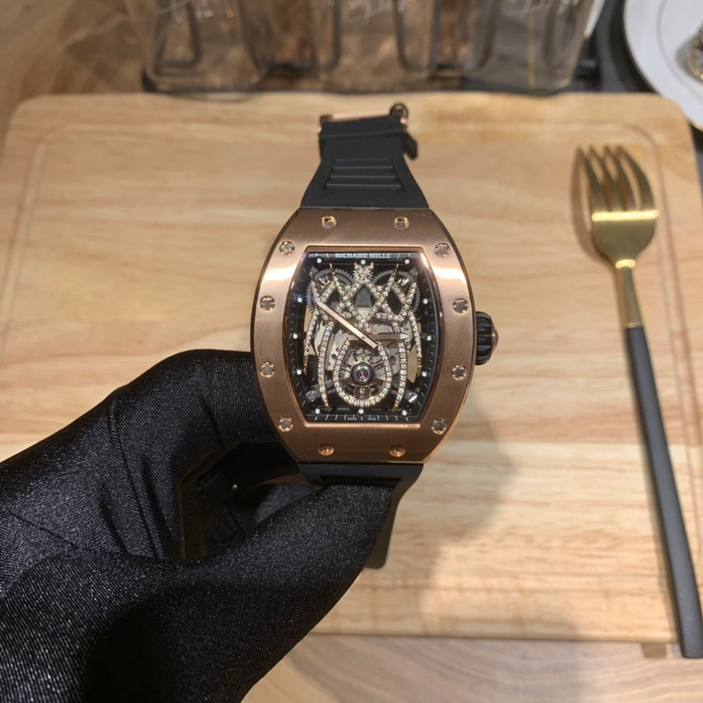 Richard Mille skeleton watch front view with black rubber strap and rose gold-toned case