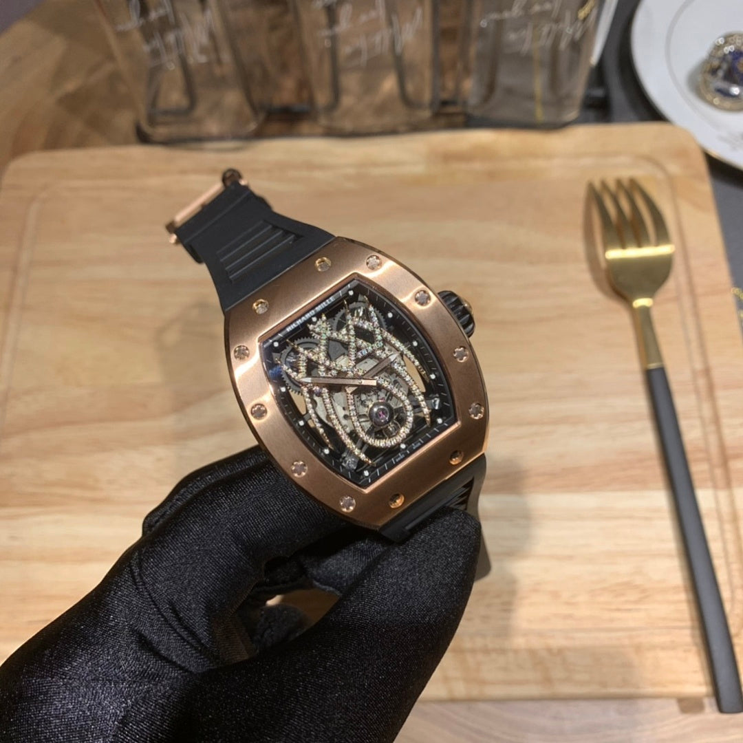 Richard Mille watch angled view with black rubber strap and rose gold-toned case