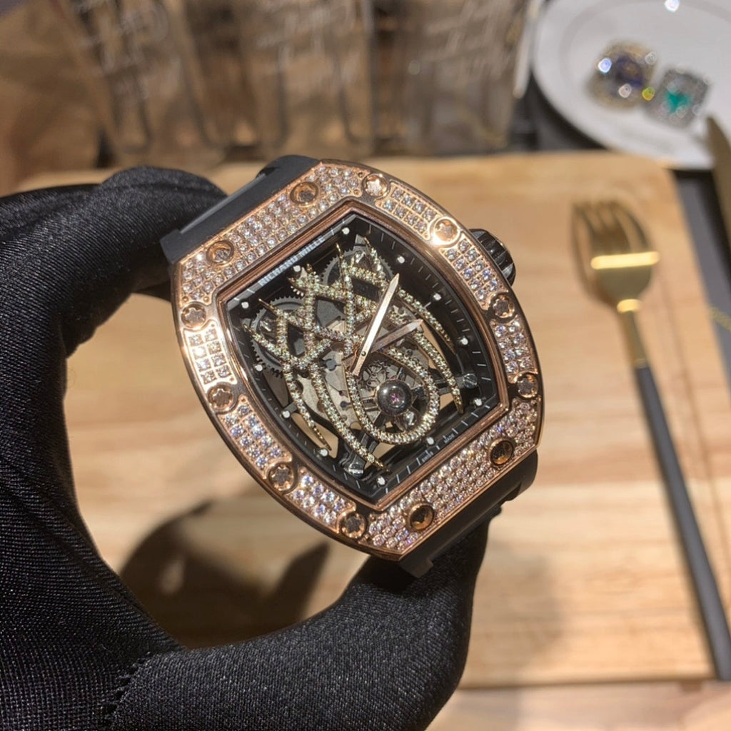 Richard Mille skeleton dial wristwatch in rose gold with diamond bezel and black strap