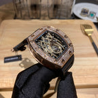 Richard Mille rose gold wristwatch with diamond bezel and black rubber band