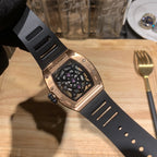 Richard Mille side view wristwatch with black rubber band and rose gold case