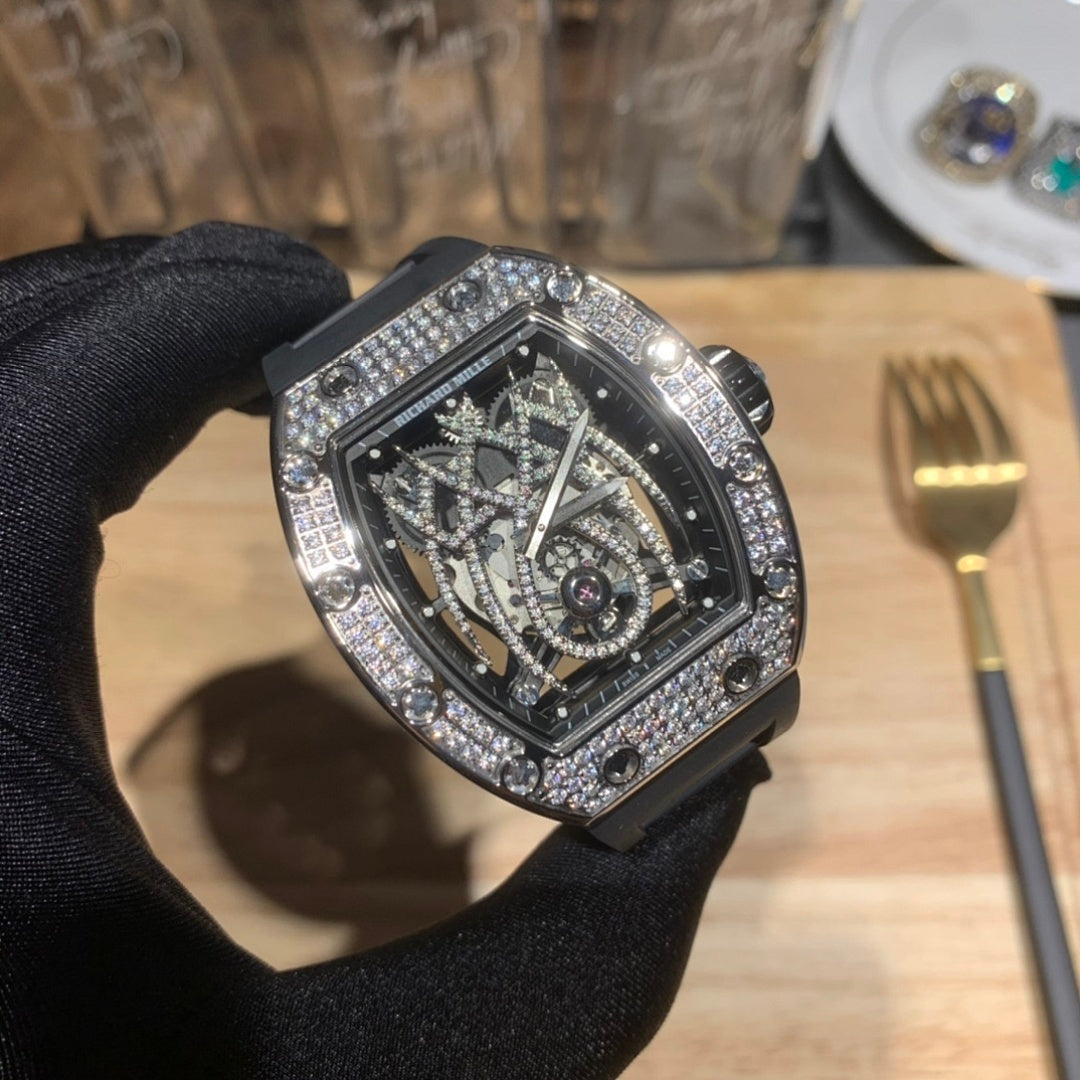 Richard Mille watch close-up, black dial with exposed movement, jeweled bezel, black strap