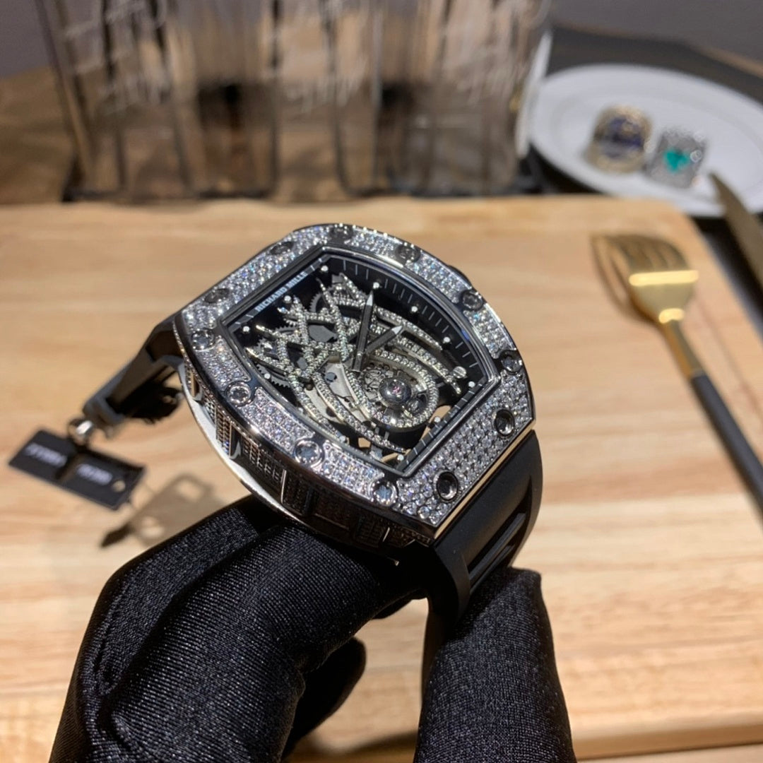 Richard Mille watch three-quarter view, black rubber strap, gem-set bezel, skeleton dial