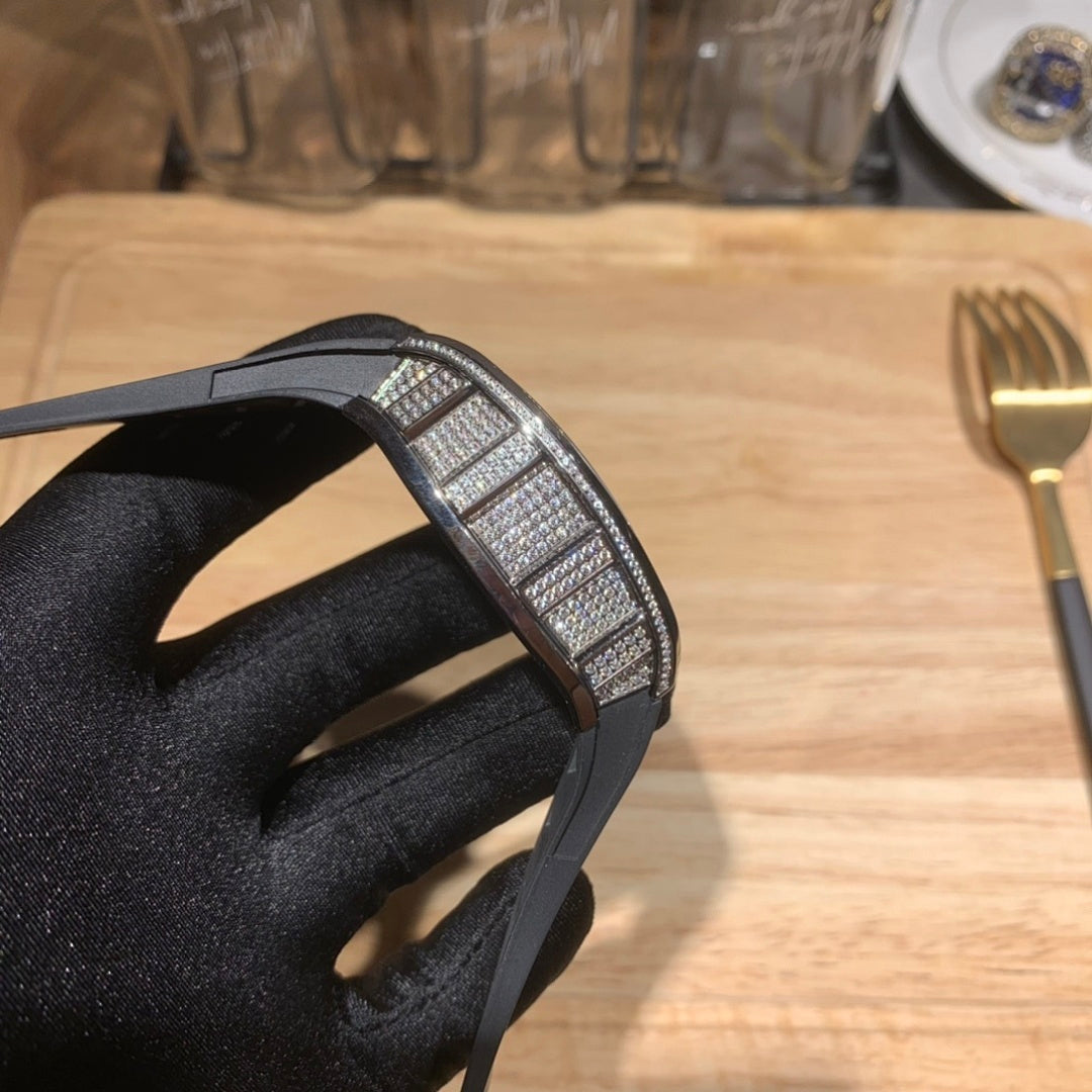 Richard Mille watch side band view, black rubber strap with textured center, jeweled case edge