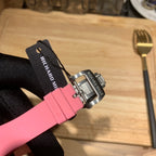 Richard Mille watch strap clasp view: pink rubber strap and silver buckle with markings