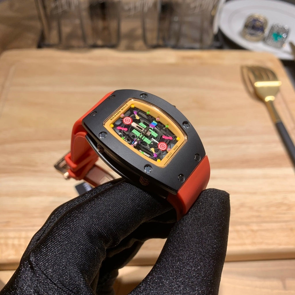 Watch on hand: black case, orange strap, colorful skeleton dial with gold frame