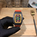 Richard Mille watch with black case, orange strap, and colorful transparent dial display