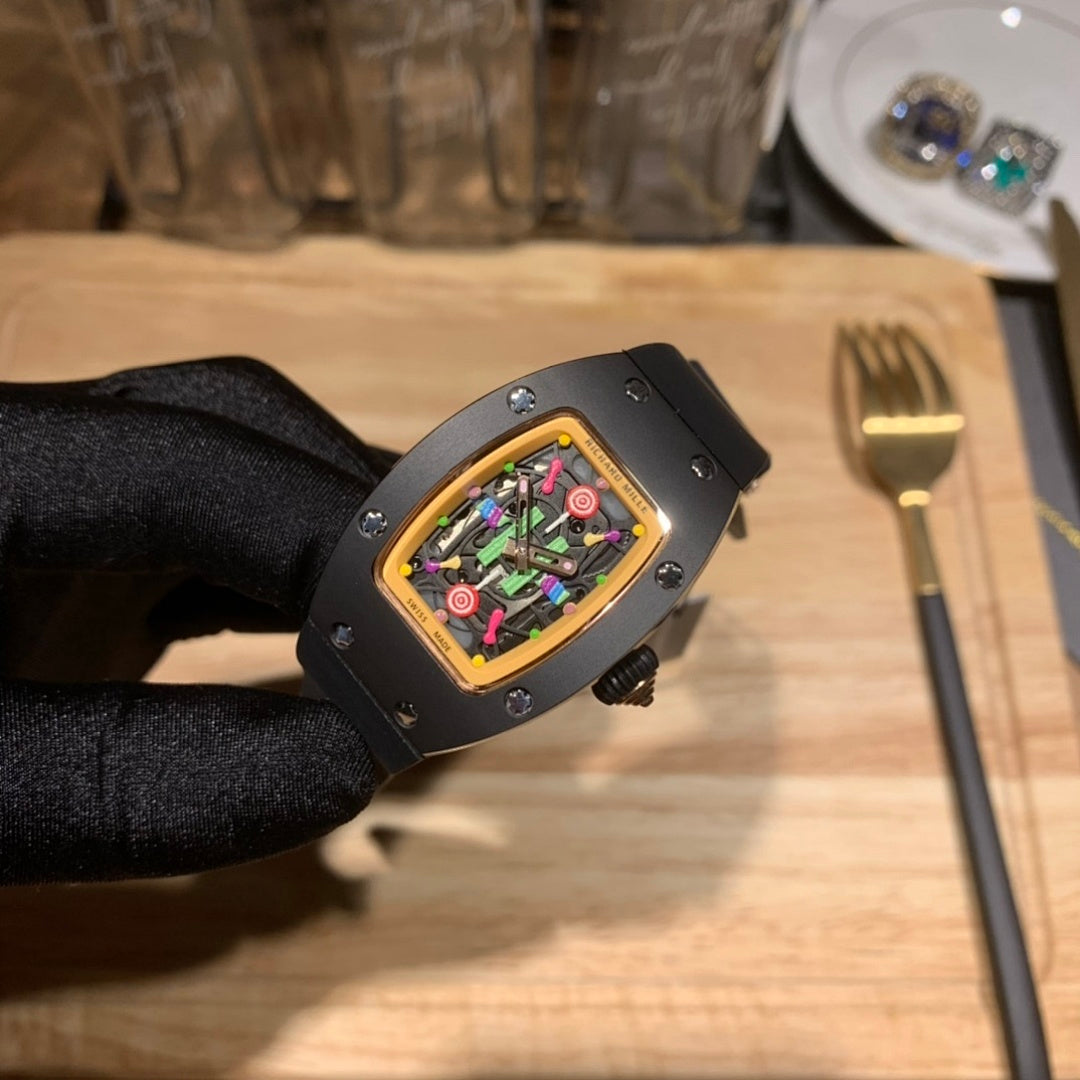 Black Richard Mille watch with multicolor dial, black case and rubber strap