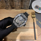 Richard Mille wristwatch angled view on black strap, jeweled case with open dial detail