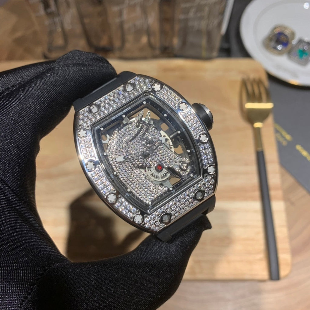 Richard Mille wristwatch close-up, faceted crystal edge and jeweled bezel on black strap