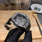 Richard Mille wristwatch front view, ornate jeweled bezel and black rubber strap