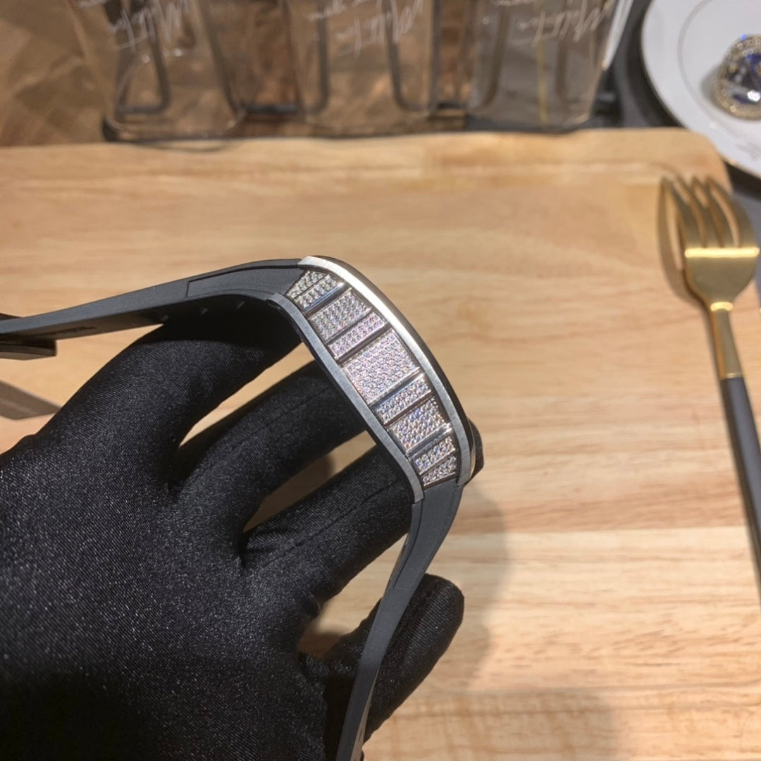 Richard Mille wristwatch profile view, black rubber strap with metal bezel detail