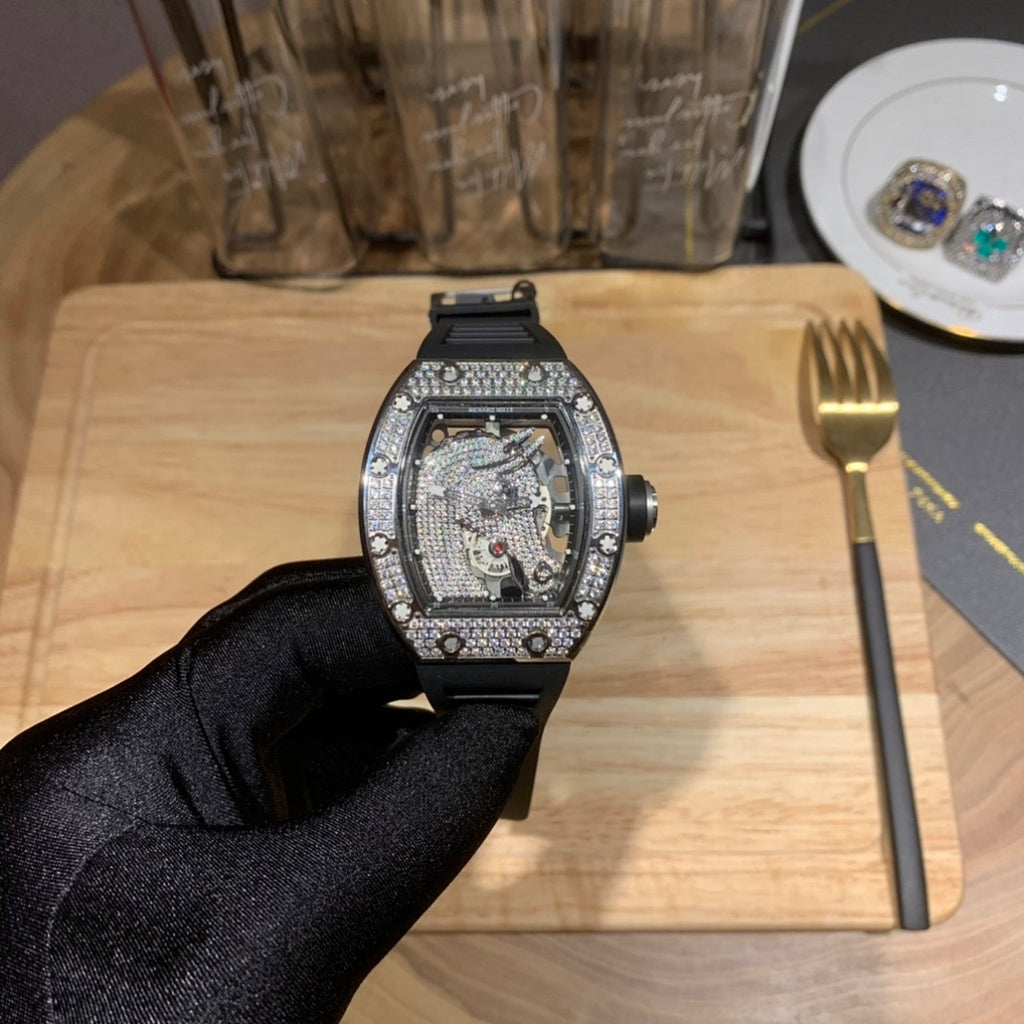 Richard Mille wristwatch front view with jeweled bezel and black rubber strap