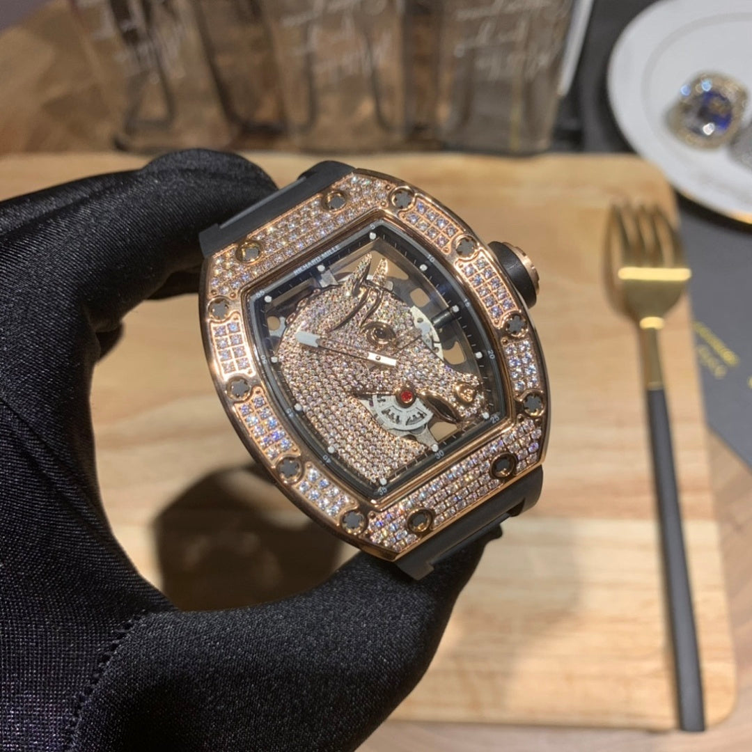 Rectangular skeleton watch with diamond bezel and black rubber strap
