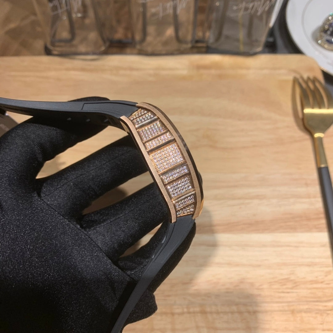 Diamond-set watch case side view with black rubber strap