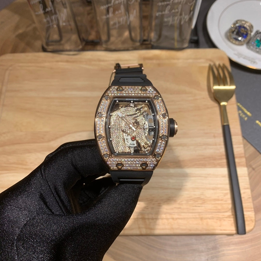 Skeleton watch with black rubber strap and jeweled rectangular bezel