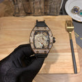 Richard Mille skeleton watch with black rubber strap and jeweled bezel